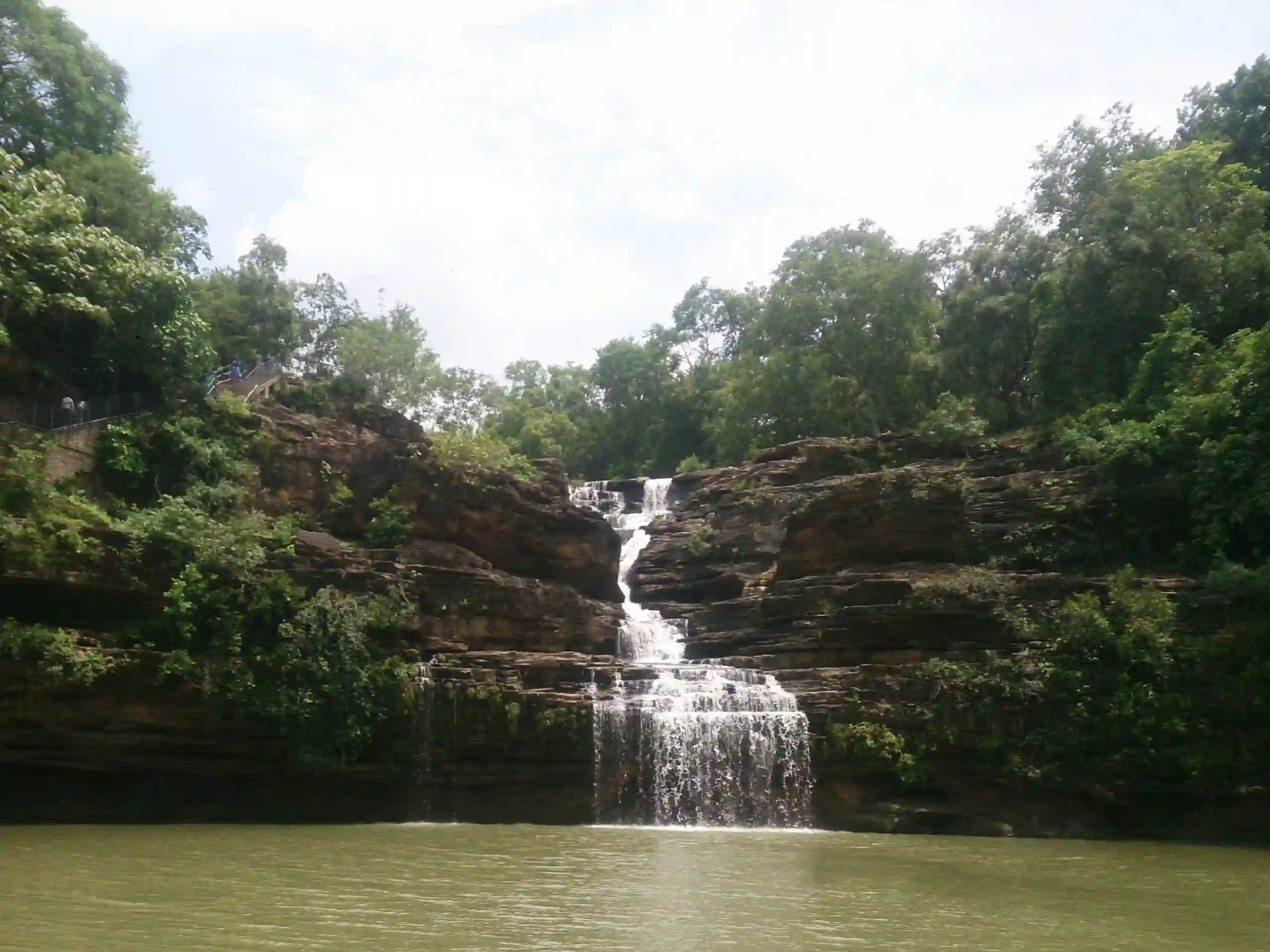 Pandav Falls cascading into a forest pool in Panna